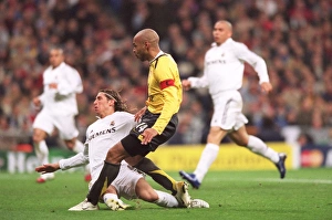 Thierry Henry scores Arsenals goal under presure from Sergio Ramos (Real) Thierry Henry scores Arsenals goal under presure from Sergio Ramos (Real)