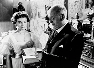 Alastair Sim and Eileen Moore in a scene from An Inspector Calls (1954) Alastair Sim and Eileen Moore in a scene from An Inspector Calls (1954)