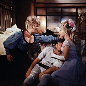 Joan Sims, Jim Dale and Angela Douglas in a scene from Carry On Cowboy Joan Sims, Jim Dale and Angela Douglas in a scene from Carry On Cowboy