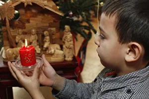 6-year-old boy holding a Christmas candle 6-year-old boy holding a Christmas candle