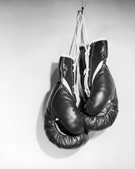 Boxing gloves hanging on the wall Boxing gloves hanging on the wall