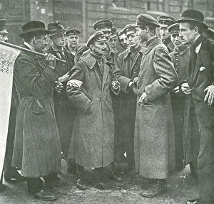 Civilians talking to soldier on street Civilians talking to soldier on street