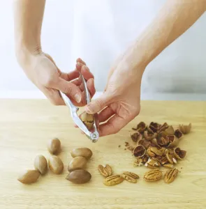 Food Preparation Techniques Prints: Using a nutcracker to shell pecans and walnuts