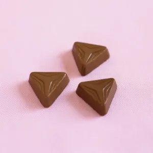 Food And Drink Images Prints: Three triangular shaped chocolates