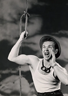 Man holding onto rope and shouting Man holding onto rope and shouting
