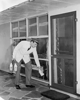 Milkman delivering milk door to door Milkman delivering milk door to door