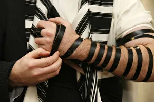 Orthodox Jew putting on phylactery Orthodox Jew putting on phylactery