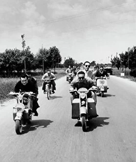 Italian Heritage Collection: People on scooters. 1952