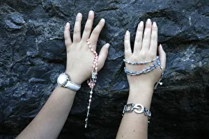 Pilgrims touching the Lourdes grotto Pilgrims touching the Lourdes grotto