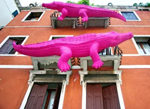 Pink crocodiles on facade of building, Venice, Italy