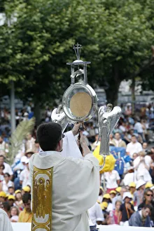 Priest holding the holy sacrament Priest holding the holy sacrament