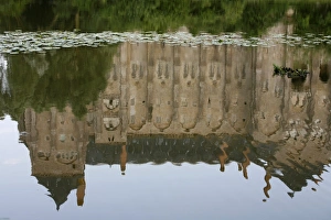 Saint-Pierre of Solesmes abbey reflected in the Sarthe river Saint-Pierre of Solesmes abbey reflected in the Sarthe river