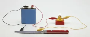 Science Experiment Setup Prints: Testing for conductivity using a battery connected by a lead to a small light bulb