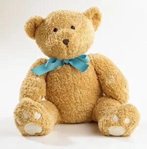 Teddy bear with blue ribbon bow tie Our beautiful Wall Art and Photo Gifts include Framed Prints Photo Prints Poster Prints Canvas Prints Jigsaw Puzzles Metal Prints and so much more