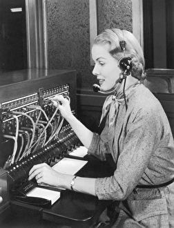 Telephone operator working at switchboard Telephone operator working at switchboard