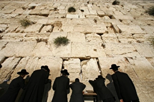 Ultra-orthodox Jewish men pray at the Western Wall in the Old City of Jerusalem Ultra-orthodox Jewish men pray at the Western Wall in the Old City of Jerusalem
