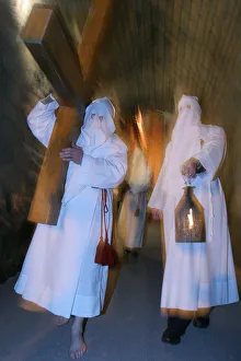 White penitentss Easter week procession in Le Puy en Velay White penitentss Easter week procession in Le Puy en Velay