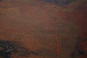 Aerial view of a dirt road positioned in a remote landscape Aerial view of a dirt road positioned in a remote landscape