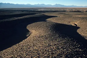 Desert plain with Andes Mountains in the background Desert plain with Andes Mountains in the background