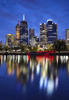 Financial district of Melbourne and River Yarra illuminated at night Financial district of Melbourne and River Yarra illuminated at night