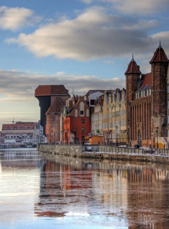 Gdansk Motlawa river bank with Crane Gate view Gdansk Motlawa river bank with Crane Gate view