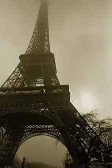 Famous Landmarks Europe Prints: Image of the Eiffel Tower Under a Floggy Sky, Low Angle View, Paris, France