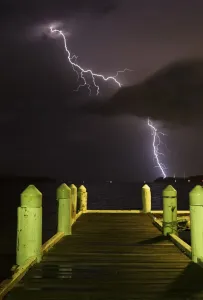 Print of Lightning Strikes Over a Jetty at Night