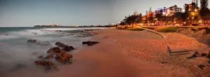 Mooloolaba Beach in the early evening at dusk with the lights of the buildings lit up Mooloolaba Beach in the early evening at dusk with the lights of the buildings lit up