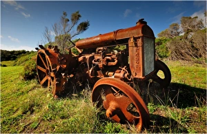 Old and abandoned tractor rusting away on King Island, Bass Strait, Tasmania, Australia Old and abandoned tractor rusting away on King Island, Bass Strait, Tasmania, Australia