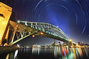 Star trails over Sydney Harbour bridge and Opera House Star trails over Sydney Harbour bridge and Opera House