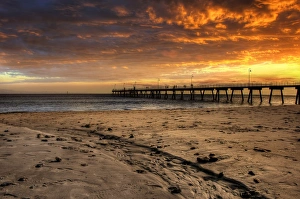 Sunset at Glenelg Beach with Glenelg Jetty in the Background, Adelaide, South Australia Sunset at Glenelg Beach with Glenelg Jetty in the Background, Adelaide, South Australia