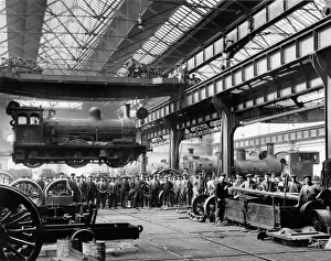 Crowds watching a suspended locomotive at the North Eastern Railways Gateshead Works Crowds watching a suspended locomotive at the North Eastern Railways Gateshead Works