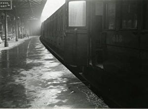 Wigan station, Lancashire & Yorkshire Railway. View of a train with a compartment door Wigan station, Lancashire & Yorkshire Railway. View of a train with a compartment door