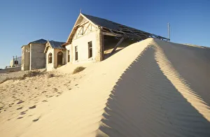 Abandoned Houses with Sand Dune in Foreground Abandoned Houses with Sand Dune in Foreground