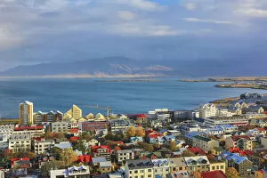 Iceland Collection: Aerial view over downtown Reykjavik with ocean and mountain at back, Iceland