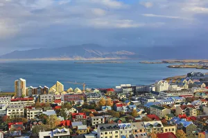 Aerial view over downtown Reykjavik with ocean and mountain at back, Iceland Aerial view over downtown Reykjavik with ocean and mountain at back, Iceland