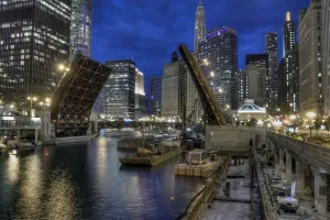 Prints of A photograph looking East over the Chicago River towards the State St Bridge in the open position World Famous Bridges Prints: Blue Hour on the Chicago River Print - State St Bridge
