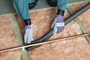 Attaching pipe insulation to a copper pipe above joists and insulation blanket Attaching pipe insulation to a copper pipe above joists and insulation blanket