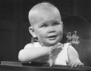 Baby boy (6-9 months) sitting in highchair (B&W) Baby boy (6-9 months) sitting in highchair (B&W)