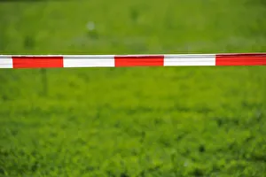 Bandrole, warning tape, red and white, front lawn Bandrole, warning tape, red and white, front lawn