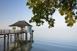 Bath house in the last evening light with gentle autumn fog near Kesswil on Lake Constance, Switzerland, Europe Bath house in the last evening light with gentle autumn fog near Kesswil on Lake Constance, Switzerland, Europe