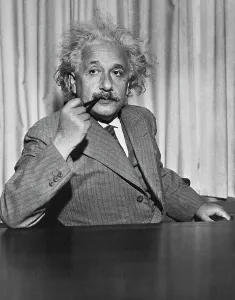 Famous Physicist Prints: Albert Einstein Smoking Pipe at Table