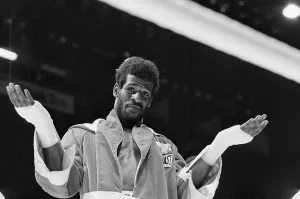Olympic Gold Medalists Prints: Michael Spinks Gesturing in Ring
