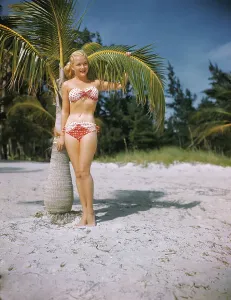 Retro Swimwear Fashion Prints: Rae Stratton Standing on Beach