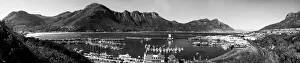 A black and white panoramic picture of Hout Bay with Hout Bay Beach on the left and the marina A black and white panoramic picture of Hout Bay with Hout Bay Beach on the left and the marina