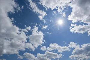 Blue sky with sun and clouds, Thuringia, Germany Blue sky with sun and clouds, Thuringia, Germany