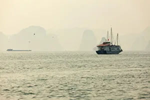 boats cruising around karst in the world famous place halong bay in north Vietnam boats cruising around karst in the world famous place halong bay in north Vietnam