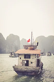 boats cruising around karst in the world famous place halong bay in north Vietnam boats cruising around karst in the world famous place halong bay in north Vietnam