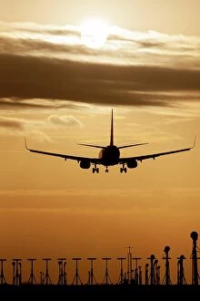 Boeing Collection: Boeing 737 aircraft landing at an airport at sunset, Stansted, Essex, England, United Kingdom