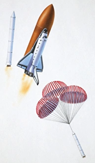 Booster rockets separating from space shuttle after liftoff, side view Booster rockets separating from space shuttle after liftoff, side view